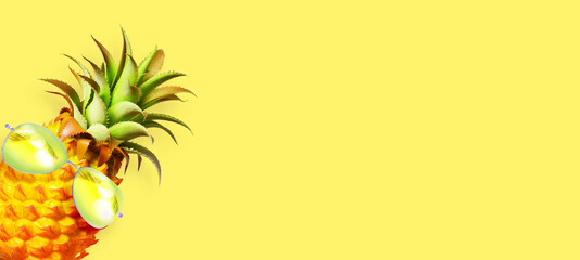 Pineapple with sunglasses on the yellow background.