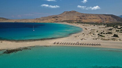 Aerial drone photo of beautiful sandy bay and double turquoise exotic beach of Simos resembling a blue lagoon in small island of Elafonisos, Lakonia, Peloponnese, Greece