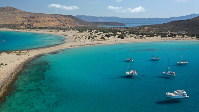 Aerial drone photo of beautiful sandy bay and double turquoise exotic beach of Simos resembling a blue lagoon in small island of Elafonisos, Lakonia, Peloponnese, Greece