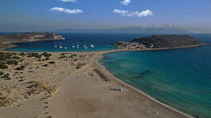 Aerial drone photo of beautiful sandy bay and double turquoise exotic beach of Simos resembling a blue lagoon in small island of Elafonisos, Lakonia, Peloponnese, Greece