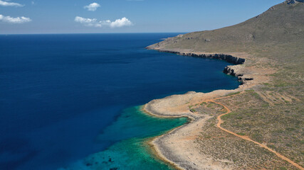 Aerial drone photo of main port of Kythera island and turquoise exotic beach of Diakofti, Ionian, Greece