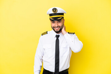 Airplane arab pilot man isolated on yellow background laughing