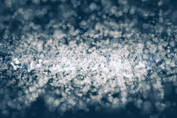 Obraz premium Abstract backdrop, bokeh on a blue background.