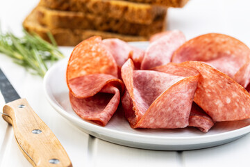 Sliced smoked salami.