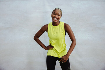 Fototapeta na wymiar Smiling african woman in sportswear