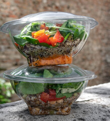 Veggie salads in plastic bowls ready to eat