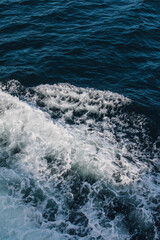 white and blue ocean waves