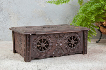 Old wooden box on concrete background.