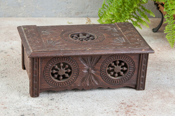 Old wooden box on concrete background.