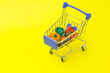 Metal shopping cart with grocery and products. Organic vegetables healthy diet. Delivery concept