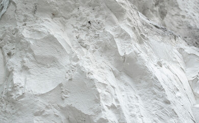 Chalk mining. Limestone quarry. Chalk hills. Chalk surface. White Stone Texture background...