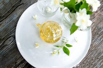 Tea with chasmina flowers in the summer garden.