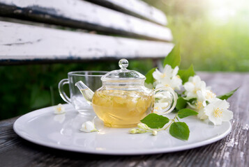 Tea with chasmina flowers in the summer garden.