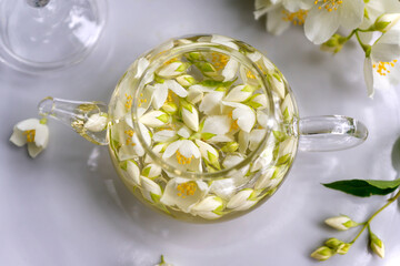 Tea with chasmina flowers in the summer garden.