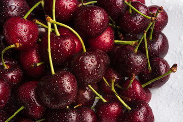 Ripe, juicy cherries in drops of water. Background from sweet cherry berries.
