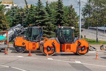 Two orange color road asphalt Rinks for laying asphalt