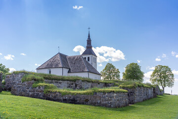 Gudhem Historical Monastery Ruin and Church in rural environment with overgrown stone walls and arches during Summer near Falkoping Vastra Gotaland, Sweden.