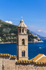 Fototapeta na wymiar Dominican monastery tower. Monastery is located at eastern part of City Dubrovnik. Dominican monastery is one of the most important architectural parts and art heritage of Dubrovnik. Croatia.