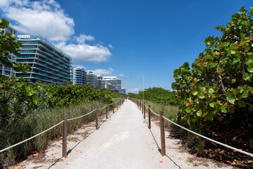 Sandy footpath in Miami, USA. Sand walking path. Summer vacation. Miami beach holidays