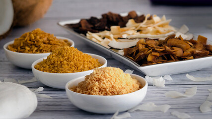 Tasty  Crunchy Toasted Coconut Chips  on White Bowls. 