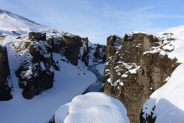 Canyon landscape, winter river, rockes under the snow
