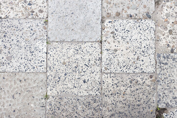 Fototapeta premium Gray paving slabs close-up. Abstract background