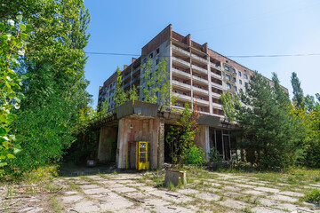 Phone box near abandoned building in centre of ghost town Pripyat Chornobyl Zone