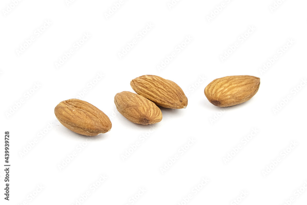 Wall mural almond nuts isolated on white background. heap of scattered almonds