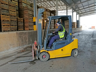 Paterna, Valencia, Spain: 10.20.2020; The operators of forklift in the warehouse