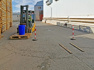 Paterna, Valencia, Spain: 10.21.2020  The operator of forklift wearing bucket of water © Oksana