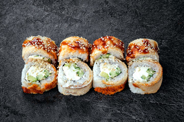 Philadelphia sushi roll set with ell fish and cream cheese. Japanese dish of unagi roll with rice, close-up