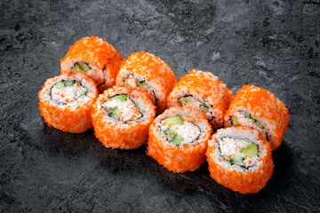 California sushi roll set with crab, cucumber and tobiko caviar. Japanese dish of crab meat with rice.