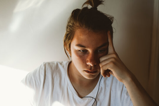 Teenager listens music with headphones