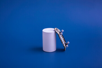 Skateboard finger on a blue background, near a white podium. Anti-stress bar for children and...