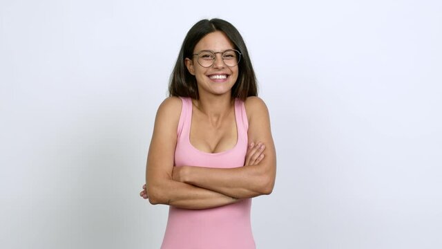 Young woman with glasses smiling over isolated background