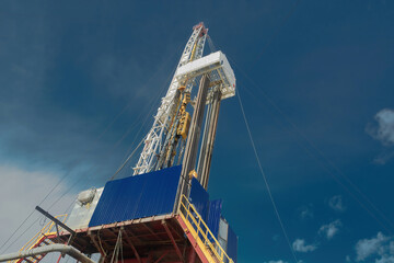 Drilling rig for drilling wells for oil and gas. General detailed view. View from the side from...