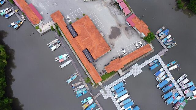 Aerial drone view of boats at a jetty complex in mangrove park Langkawi Malayisa