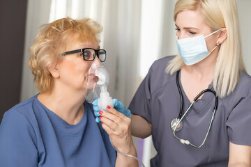 Elderly woman at doctor during coronavirus pandemic