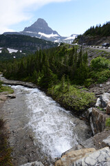 Waterfall and river at Glacier National Park, just off the Going to the Sun Road