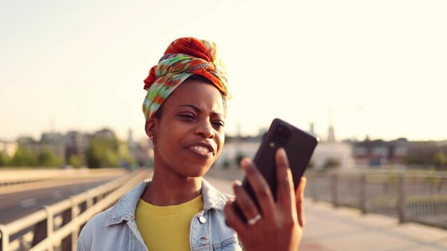 Young woman using smart phone outdoors
