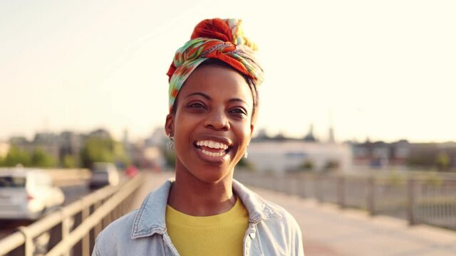 Young woman smiling at sunset
