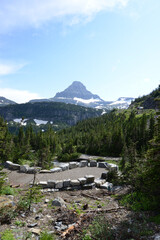 Scenic view of mountains and trees at Glacier National Park in Montana on a sunny day