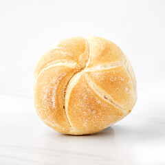 fresh Kaiser roll on a table