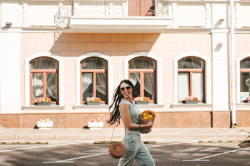 portrait of a beautiful young woman 29 years old with dark long hair on a summer day in sunglasses 