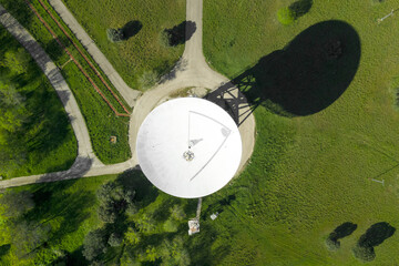 Aerial view of large telecommunications antenna or Radio telescope satellite dish. High quality photo. 
