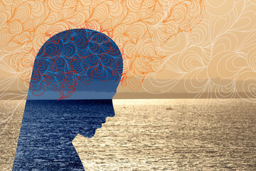 Possible Mental illness concept. Blue genetic head down silhouette in blue, sunset seaside back...