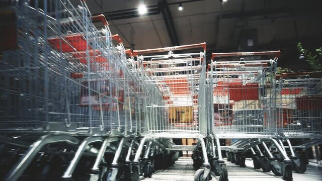 Empty shopping carts at the entrance of a supermarket