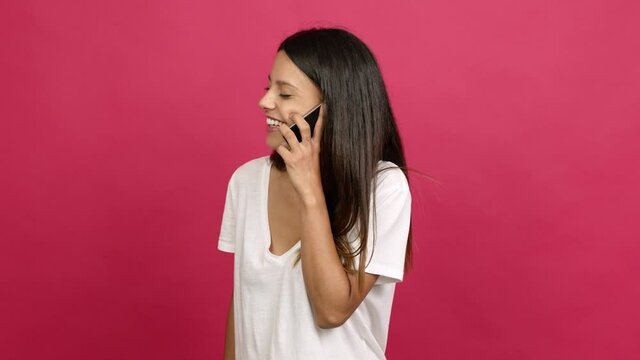 Young woman using mobile phone over isolated background