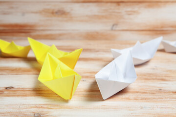 white and yellow paper boats