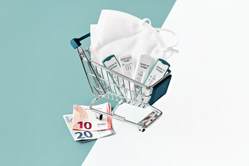 Cost of shnelltest, rapid corona test in German language. Shopping cart with covid 19 antigen tests...
